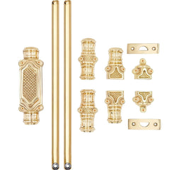 A set of ornate gold-finished hardware components, including a decorative rectangular handle, two long cylindrical rods, and several matching brackets and connectors, arranged on a plain white background.