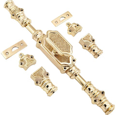A set of ornate brass door hardware components, including a pull handle, strike plate, and locksets.