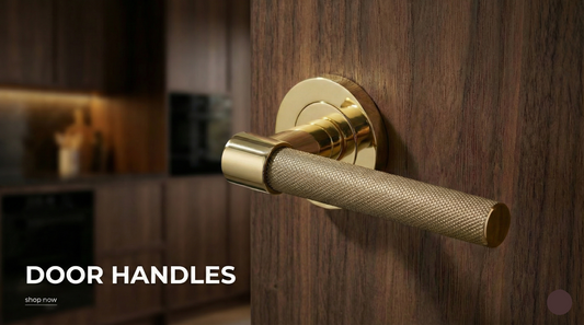 Brass handle on a wooden door 